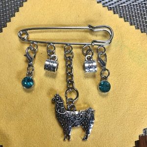NWT, Handmade by A Charmed Life. Silver Alpaca with two blue crystals